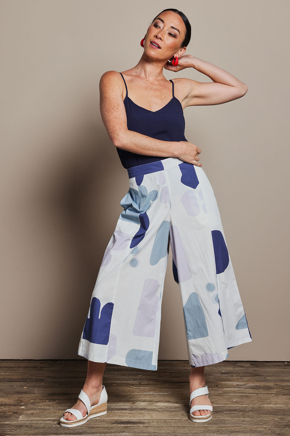 Model Katie wearing size 10 of the Cotton Pull On Pant in colour Abstract (Blue), from the front, showing the whole outfit