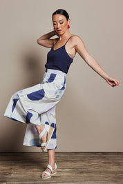 Model Katie wearing size 10 of the Cotton Pull On Pant in colour Abstract (Blue), from the front, showing the whole outfit