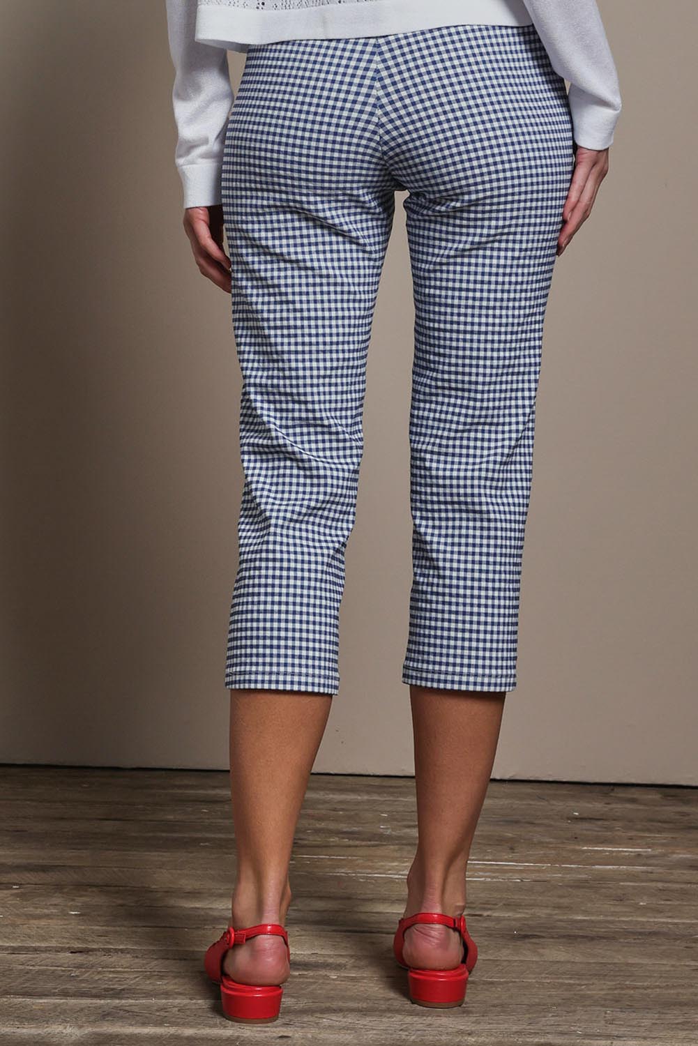 Model Madeline wearing size 10 of the Check Cotton Pull On Pant in colour Blue (Blue), from the back