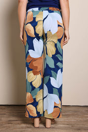 Model Georgiel wearing size 10 of the Printed Straight Leg Pull On Pant – Amberflora in colour Amberflora, from the back