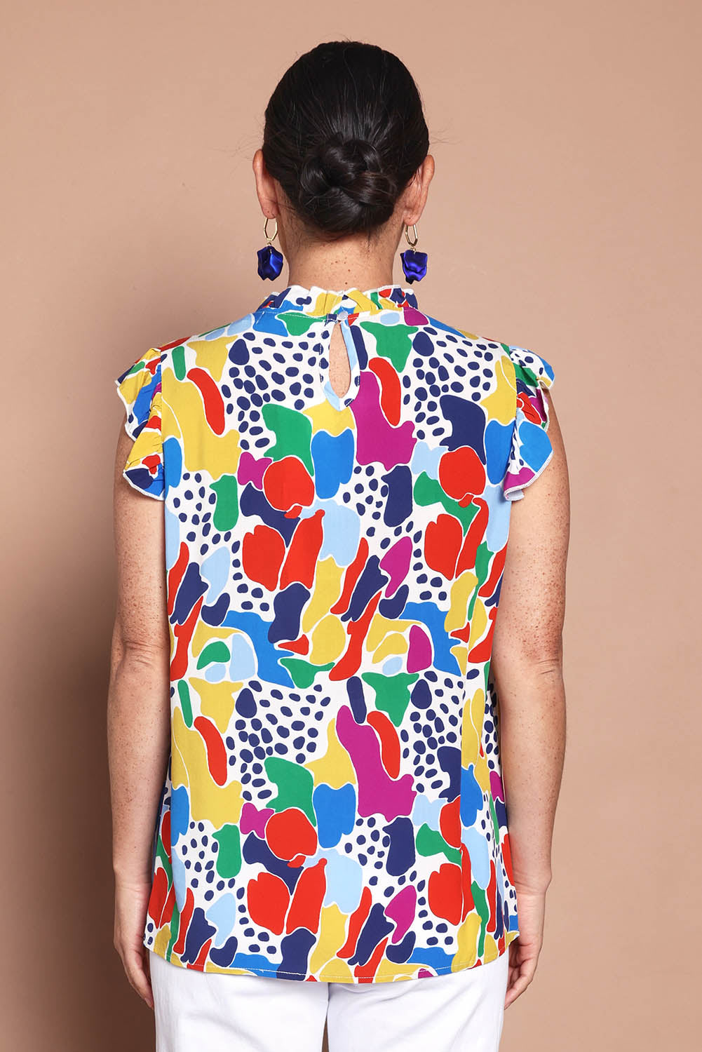 Model Katie wearing size 10 of the Frill Flutter Top in colour Jazzpop, from the back