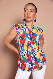 Model Katie wearing size 10 of the Frill Flutter Top in colour Jazzpop, from the front, cropped image