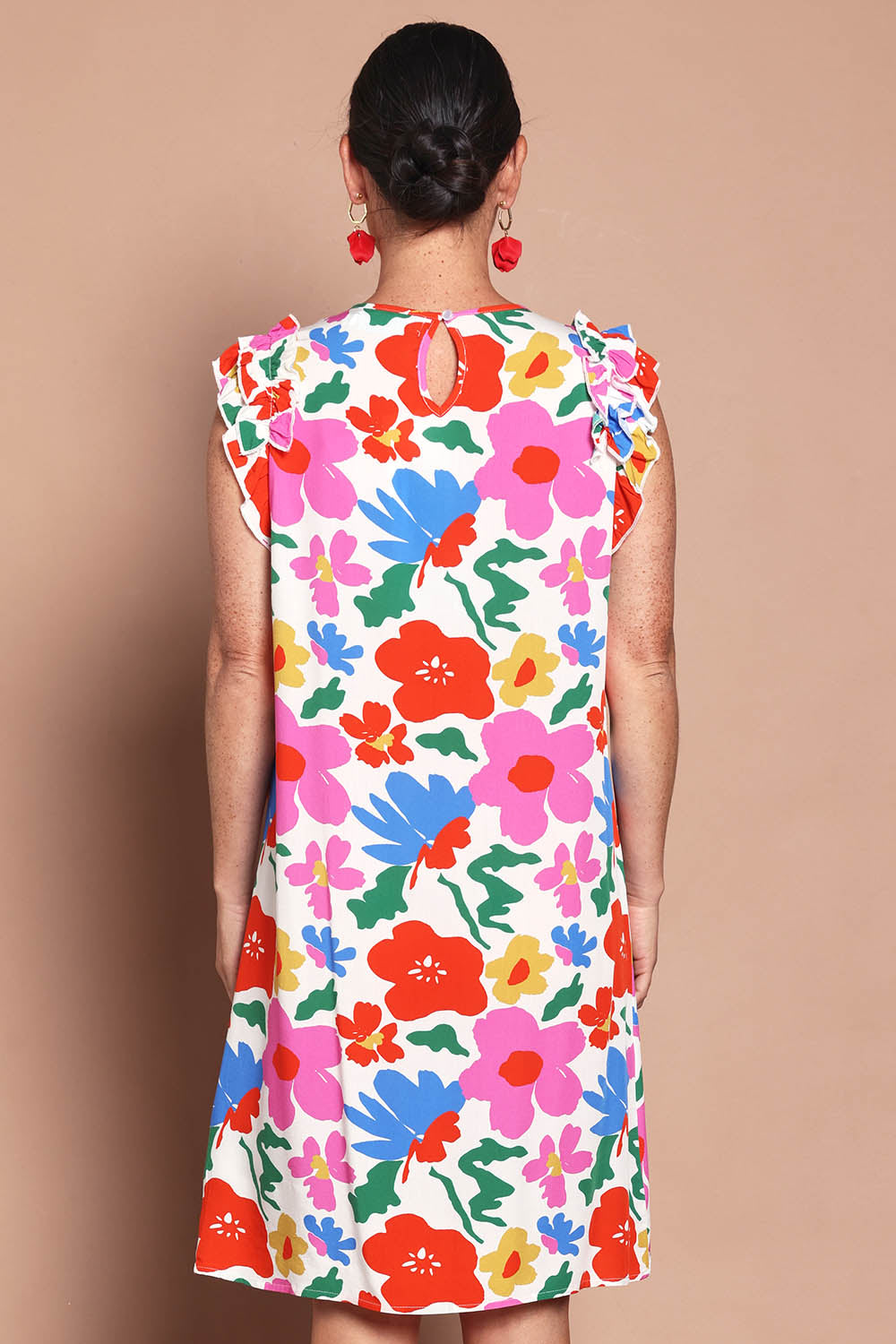 Model Katie wearing size 10 of the Printed Sleeveless Dress in colour Bloompop, from the back