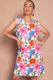 Model Katie wearing size 10 of the Printed Sleeveless Dress in colour Bloompop, from the front, cropped image