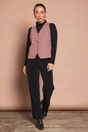Model Katie wearing size 10 of the Stretch Check Vest in colour Redcheck (Red), from the front, showing the whole outfit