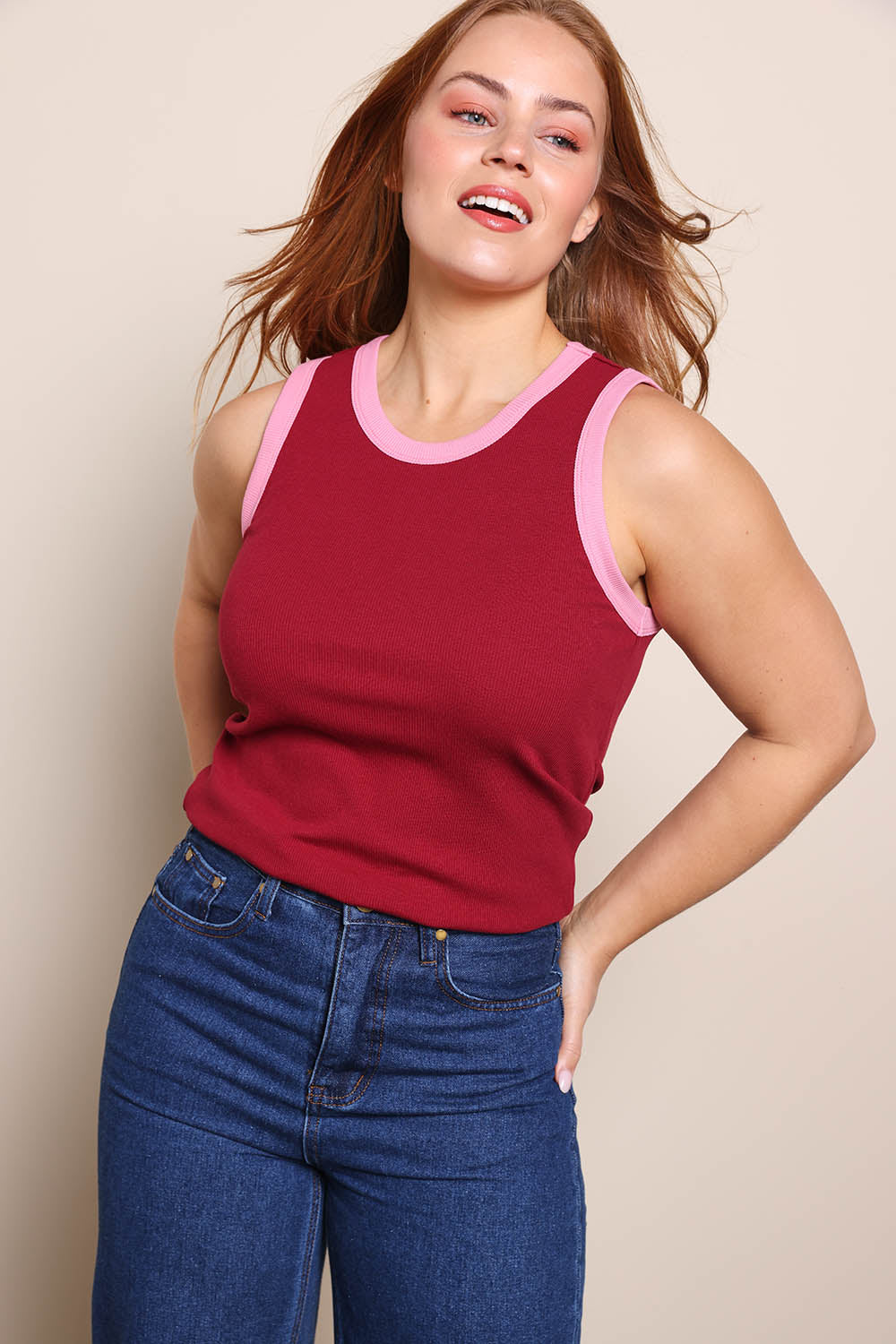 Model Georgiel wearing size 10 of the Cotton Blend Tank Top – Wine in colour Wine, in a cropped view