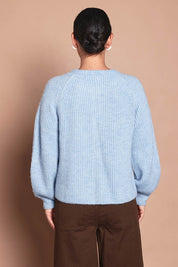 Model Katie wearing size 10 of the Wool Blend Ribbed Cardigan in colour Lightblue (Blue), from the back