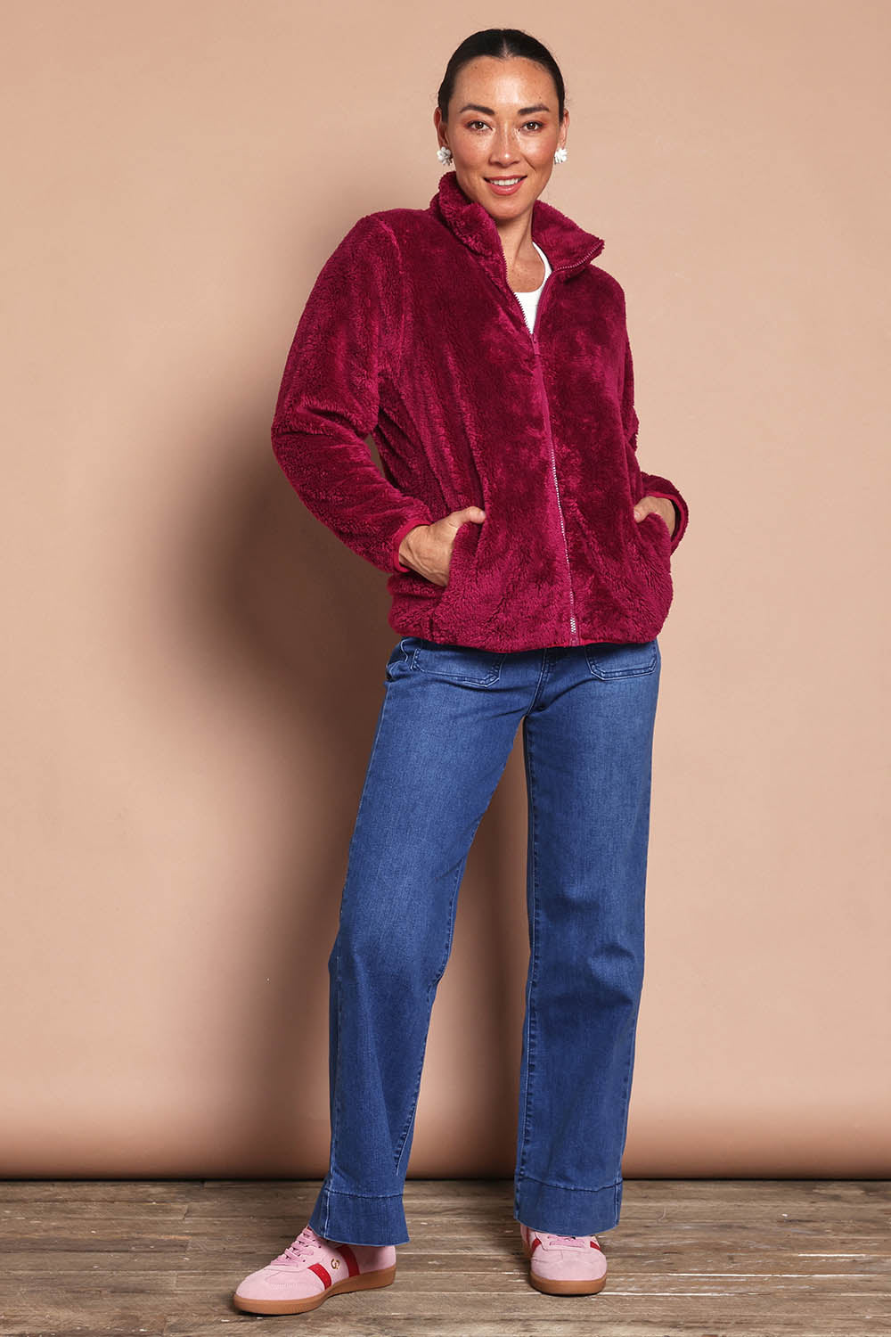 Model Katies wearing size 10 of the Fluffy Jacket - Cerise in colour Cerise, from the front