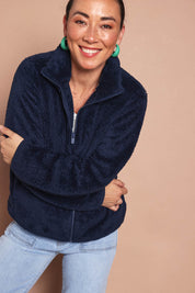 Model Katies wearing size 10 of the Fluffy Jacket - Navy in colour Navy, in a cropped view