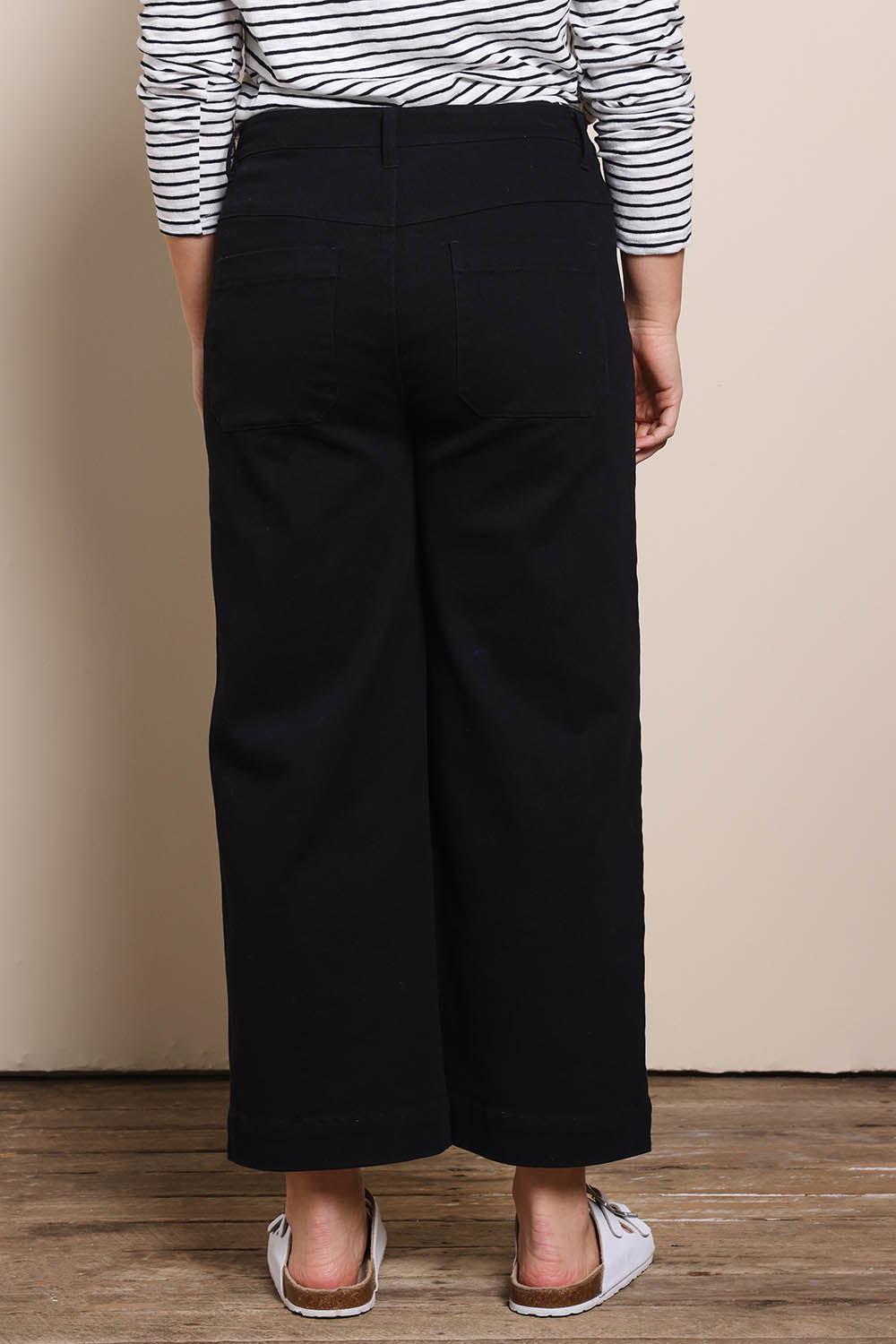 Model Georgiel wearing size 10 of the Cropped Denim Patch Pocket Jean – Black in colour Black, from the back