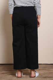 Model Georgiel wearing size 10 of the Cropped Denim Patch Pocket Jean – Black in colour Black, from the back