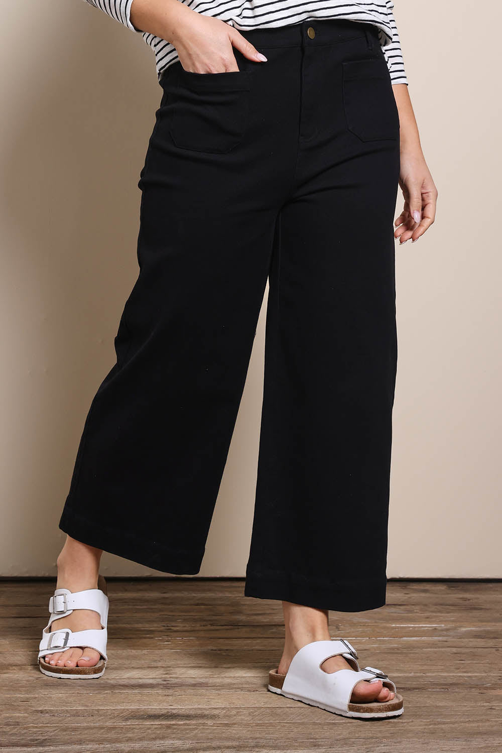Model Georgiel wearing size 10 of the Cropped Denim Patch Pocket Jean – Black in colour Black, in a cropped view