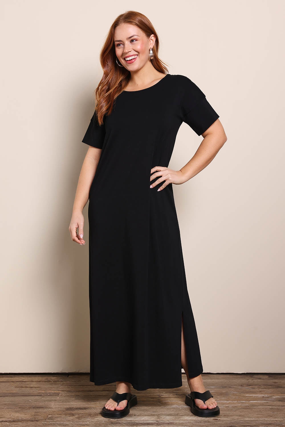 Model Georgiel wearing size 10 of the Cotton Jersey T-Shirt Dress – Black in colour Black, from the front