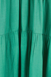 Product shot of the Relaxed Tiered Dress – Herb in colour Herb, showing detail