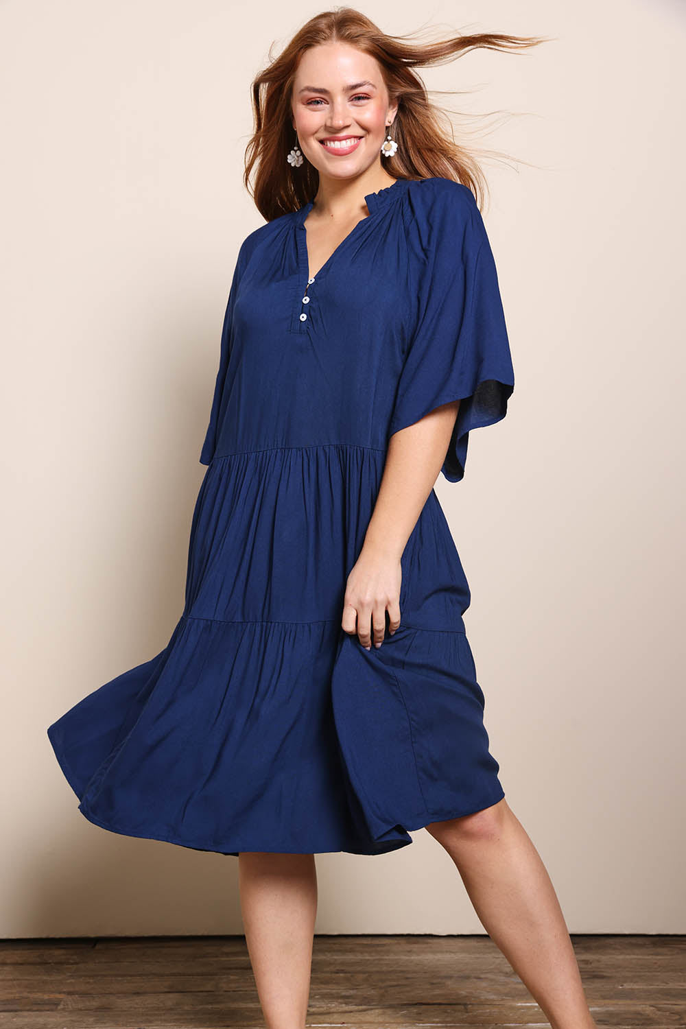 Model Georgiel wearing size 10 of the Relaxed Tiered Dress – Peacoat in colour Peacoat, from the front