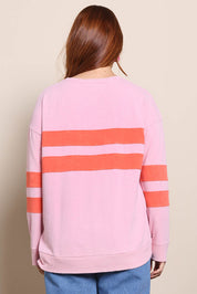 Model Georgiel wearing size 10 of the Contrast Stripe Jumper – Pink in colour Pink, from the back