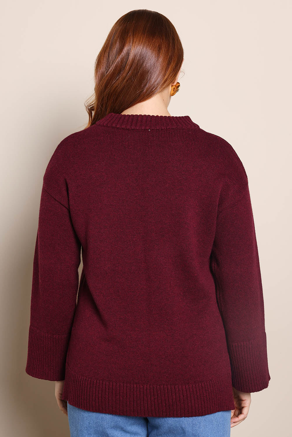 Model Georgiel wearing size 10 of the Cotton Wool Cashmere Jumper – Burgundy in colour Burgundy, from the back