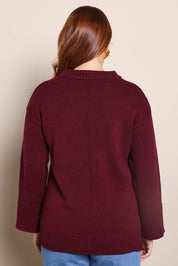 Model Georgiel wearing size 10 of the Cotton Wool Cashmere Jumper – Burgundy in colour Burgundy, from the back