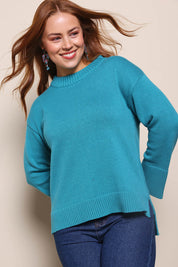 Model Georgiel wearing size 10 of the Cotton Wool Cashmere Jumper – Teal in colour Teal, from an angle