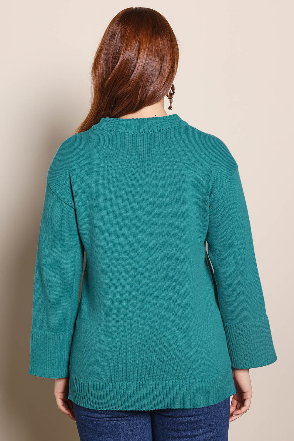 Model Georgiel wearing size 10 of the Cotton Wool Cashmere Jumper – Teal in colour Teal, from the back