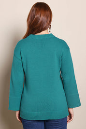 Model Georgiel wearing size 10 of the Cotton Wool Cashmere Jumper – Teal in colour Teal, from the back