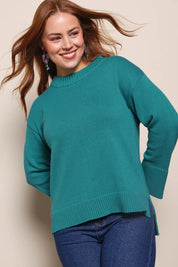 Model Georgiel wearing size 10 of the Cotton Wool Cashmere Jumper – Teal in colour Teal, in a cropped view