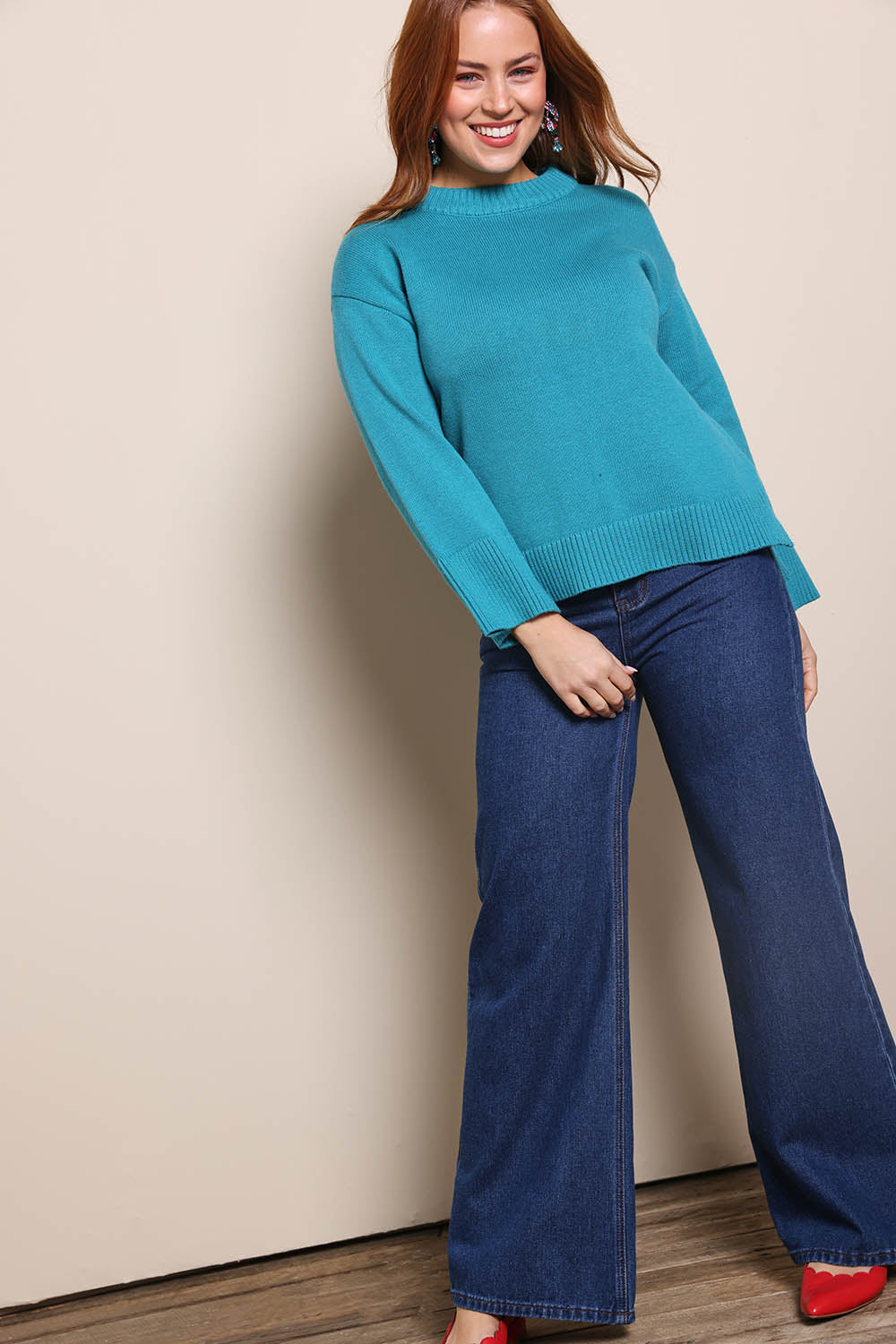 Model Georgiel wearing size 10 of the Cotton Wool Cashmere Jumper – Teal in colour Teal, from the front