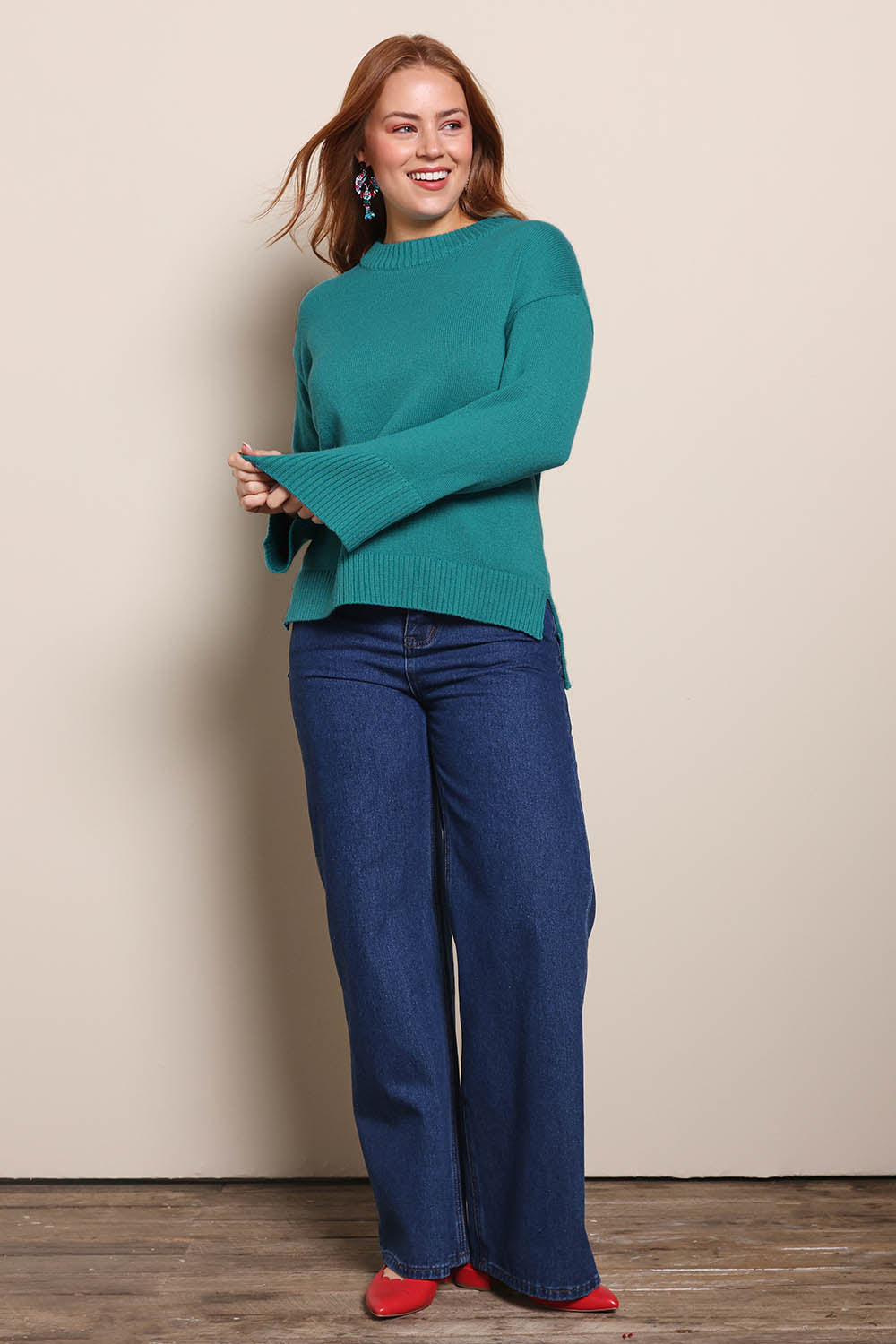 Model Georgiel wearing size 10 of the Cotton Wool Cashmere Jumper – Teal in colour Teal, from the front