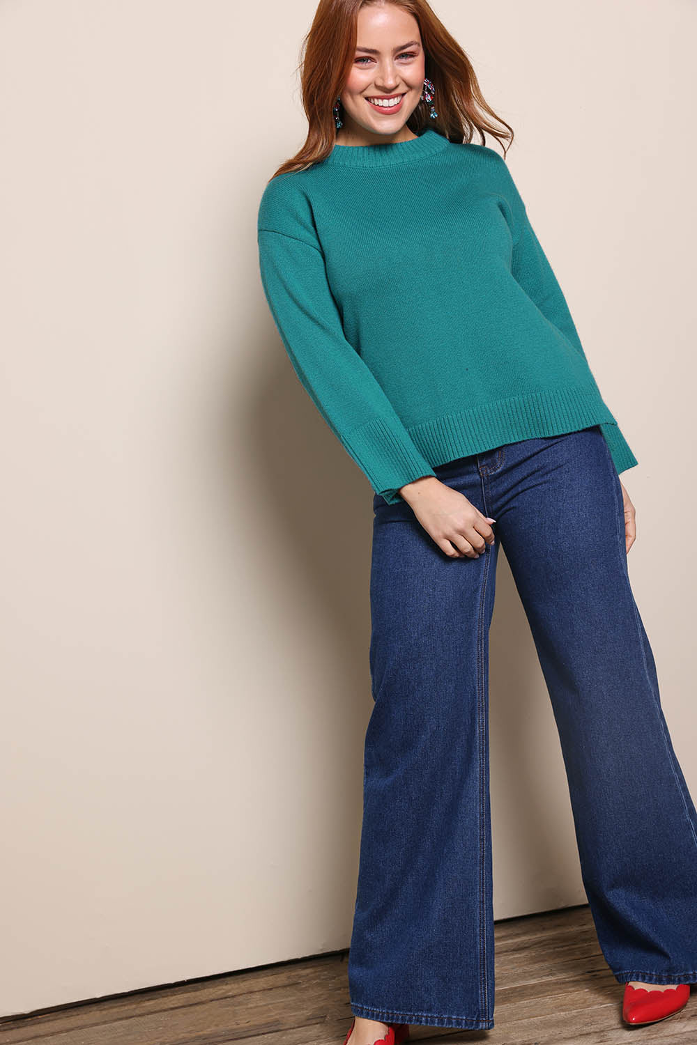 Model Georgiel wearing size 10 of the Cotton Wool Cashmere Jumper – Teal in colour Teal, from the front