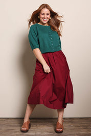 Model Georgiel wearing size 10 of the Cotton Blend Midi Skirt – Burgundy in colour Burgundy, from the front