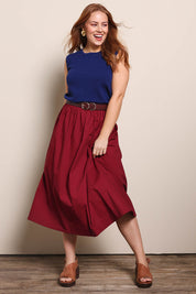 Model Georgiel wearing size 10 of the Cotton Blend Midi Skirt – Burgundy in colour Burgundy, from the front