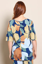 Model Georgiel wearing size 10 of the Side Split Tunic Top – Amberflora in colour Amberflora, from the back