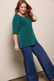 Model Georgiel wearing size 10 of the Side Split Tunic Top – Posygreen in colour Posygreen, from the front