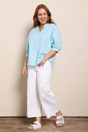 Model Georgiel wearing size 10 of the Cotton Button Down Stripe Blouse – Mint in colour Mint, from the front