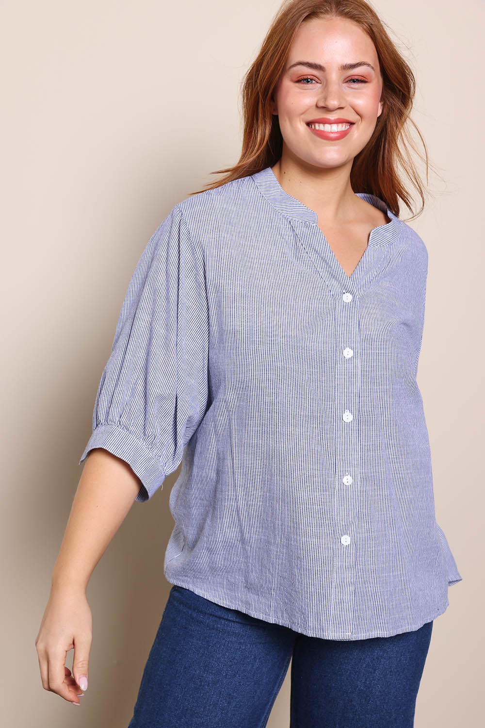 Model Georgiel wearing size 10 of the Cotton Button Down Stripe Blouse – Slate in colour Slate, in a cropped view