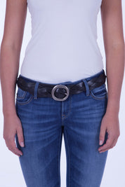 A model wearing the Louise Genuine Leather Belt in colour Black (Black), from the front, cropped image