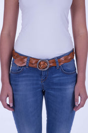 A model wearing the Louise Genuine Leather Belt in colour Tan, from the front, cropped image