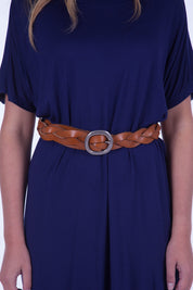 A model wearing the Louise Genuine Leather Belt in colour Tan, from the front, cropped image