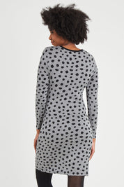 Model Aiyana wearing size S of the Wrap Dress in colour Dots (Grey), from the back