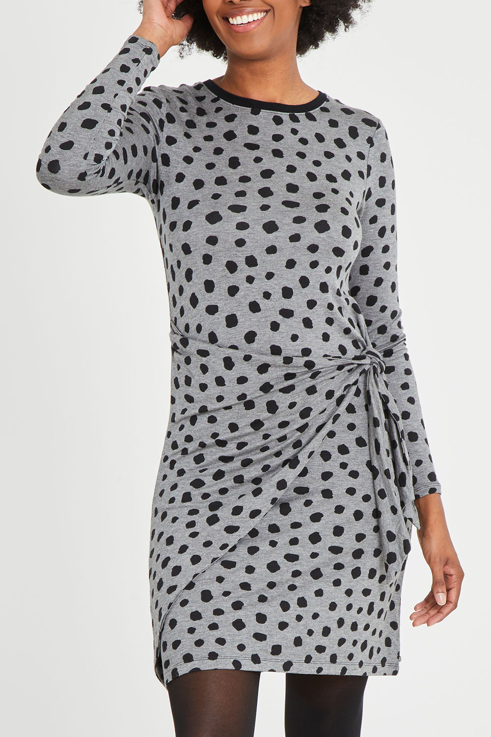 Model Aiyana wearing size S of the Wrap Dress in colour Dots (Grey), from the front, cropped image