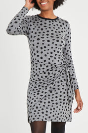 Model Aiyana wearing size S of the Wrap Dress in colour Dots (Grey), from the front, cropped image