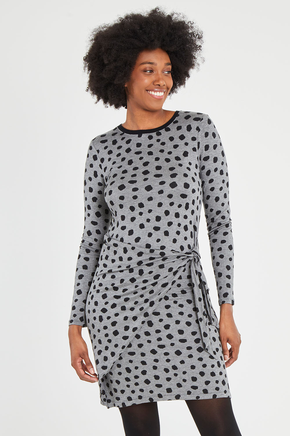 Model Aiyana wearing size S of the Wrap Dress in colour Dots (Grey), from the front, cropped image
