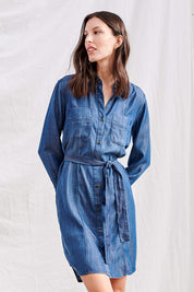 A model wearing the Riley Shirt Dress in colour Denim (Blue), from the front, cropped image