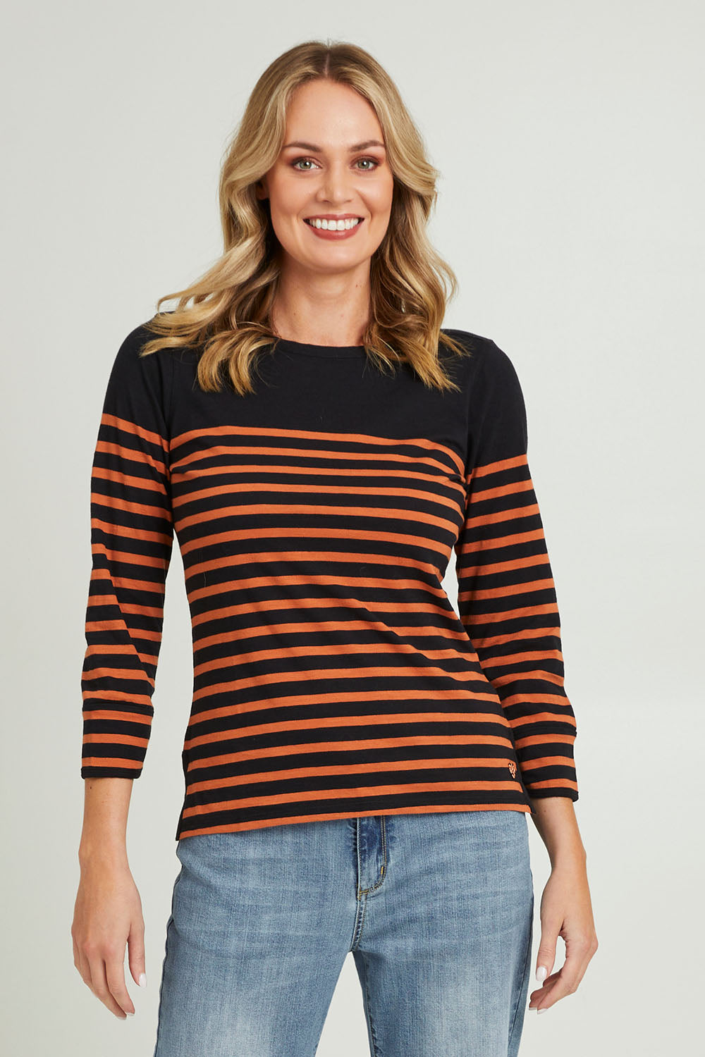 Model Grace wearing size S of the 3/4 Sleeve Breton in colour Amberstrip (Black), from the front, cropped image
