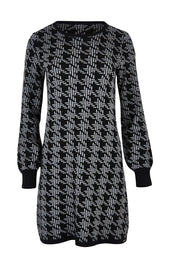 Product shot of the Abigail Sweater Dress in colour Houndstoo (Black), from the front