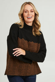 Model Grace wearing size S of the Mock Neck Tunic in colour Herrbone, from the front, cropped image