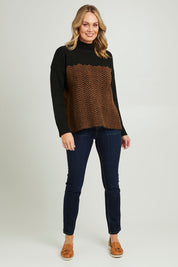 Model Grace wearing size S of the Mock Neck Tunic in colour Herrbone, from the front, showing the whole outfit