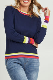 Model Grace wearing size S of the Emma Sweater in colour Rainbowstp (Blue), from the front, cropped image