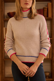 A model wearing the Raglan Pullover Jumper in colour Palesnow, from the front, cropped image
