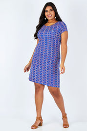 Model Shanaya wearing size L of the Nellie Triangle Stamps Dress in colour Bluecrush (Blue), from the front, showing the whole outfit